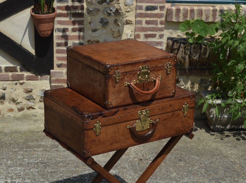 Sold at Auction: Louis Vuitton, A vintage travellers suitcase, leather and faux  leather. (D:53 x W:76 x H:18 cm)